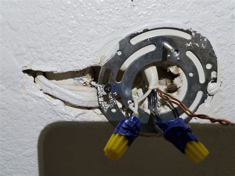 bathroom light fixture off center junction box|how to center a light fixture.